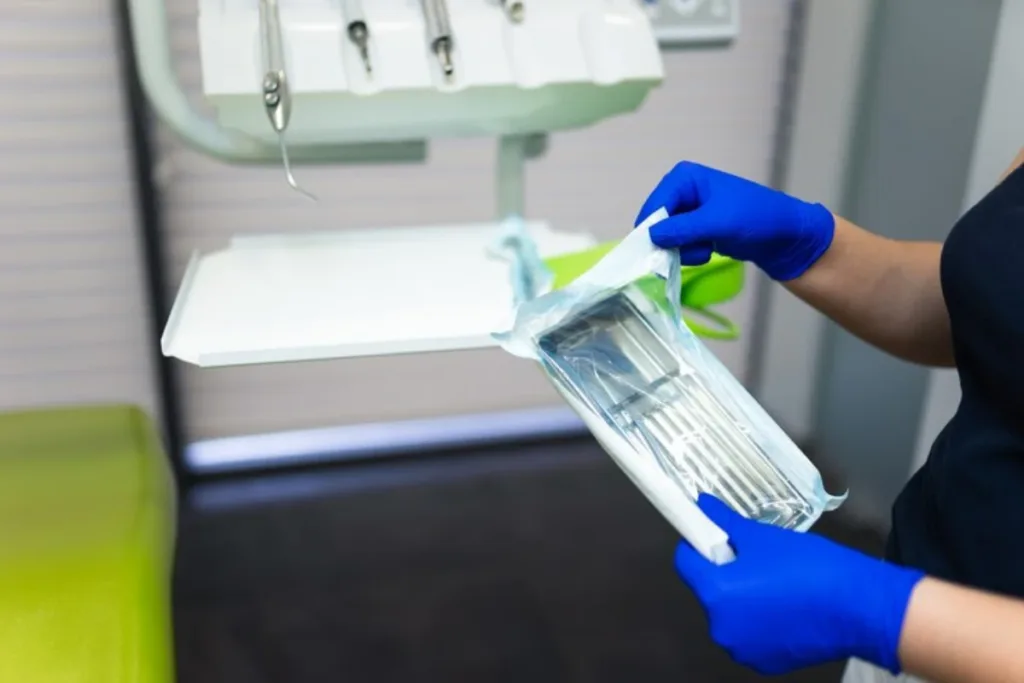 doctor opening sealed sterile dental instruments